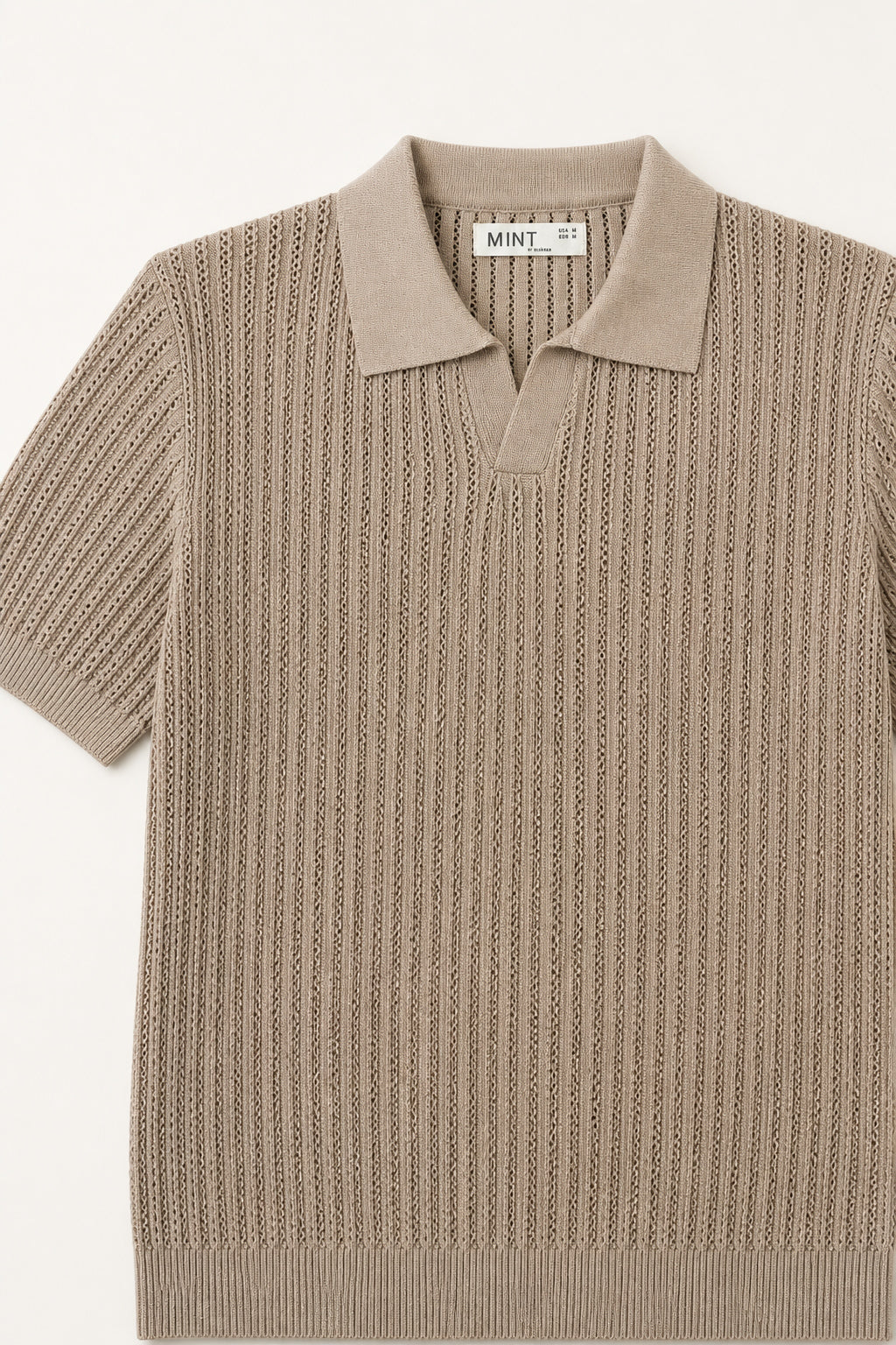 Beige knitted polo shirt with 'Mint & Co' label on a white background