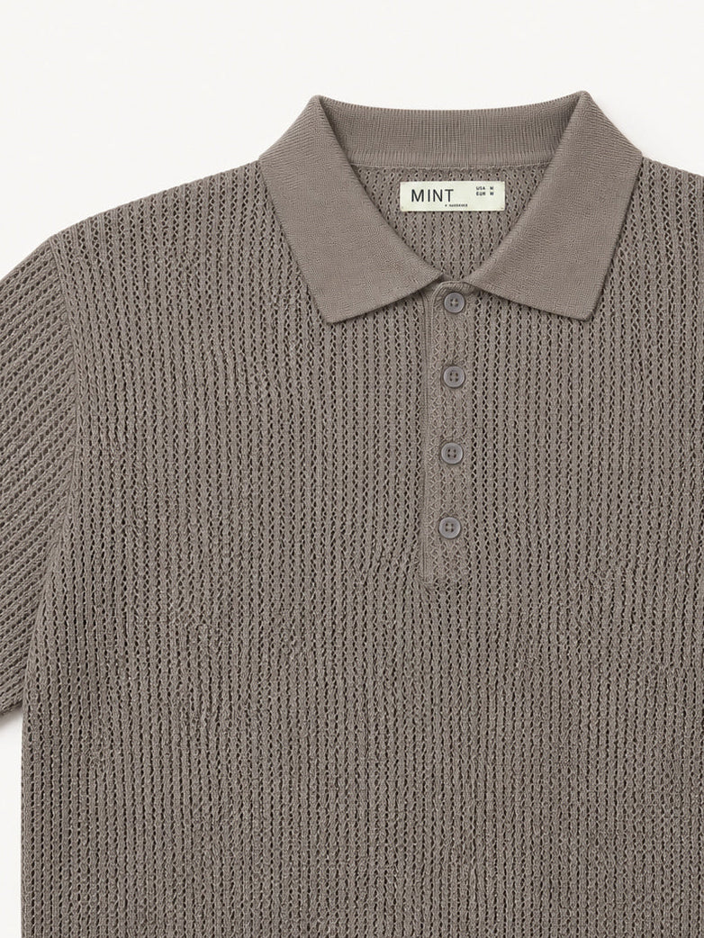 Brown knitted polo shirt on a white background